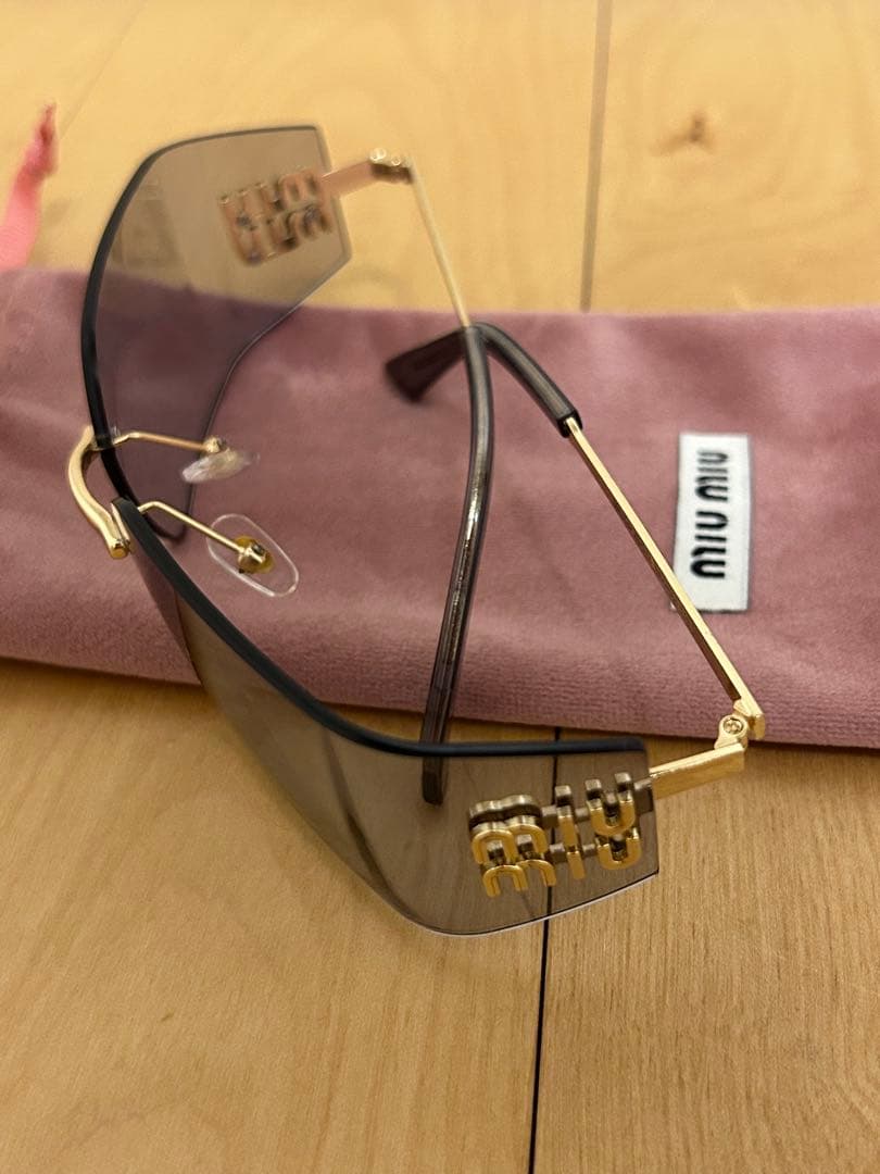 miu miu フレームレスグレーサングラス