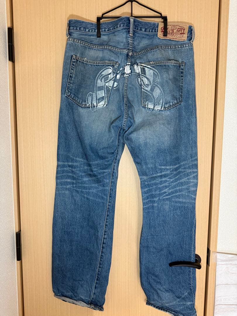 【服と書いて人】A BATHING APE 顔プリントデニムパンツ