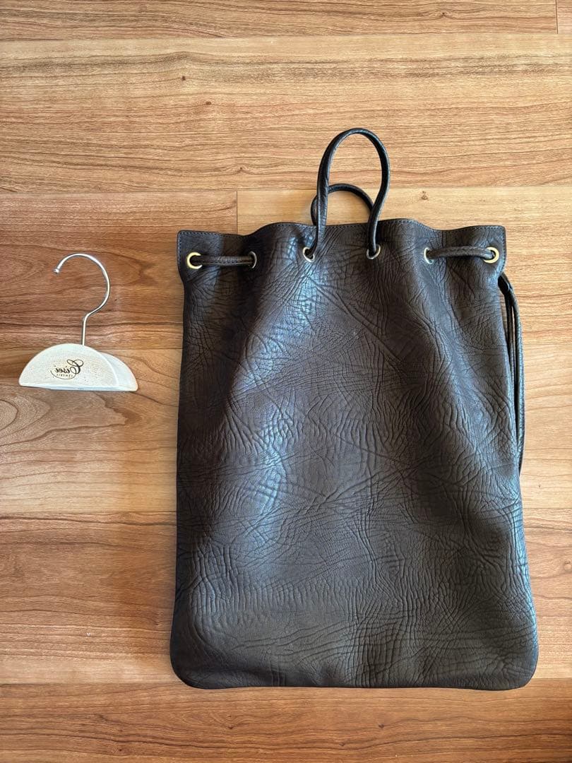 極美品 Cisei シセイ ドローストリングバッグ レザー 巾着 吊しハンガー付