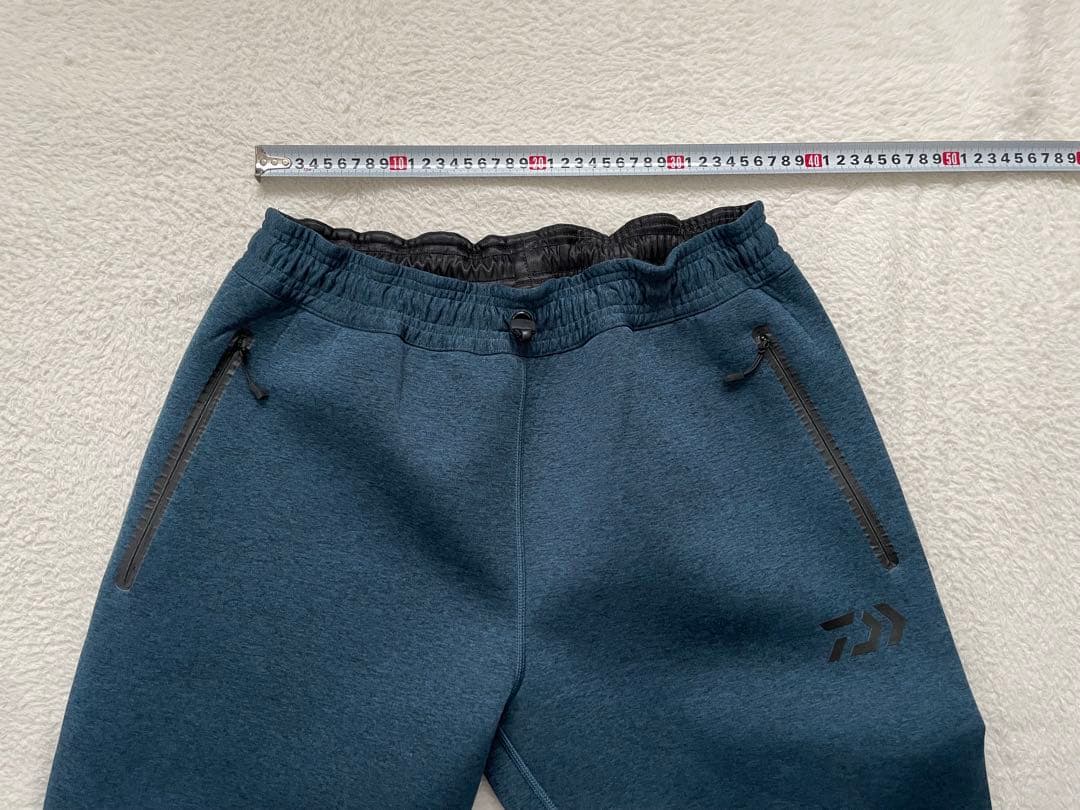 ダイワ　DAIWA ウィンドブロックジョガーパンツ　XLサイズ　フェザーブルー