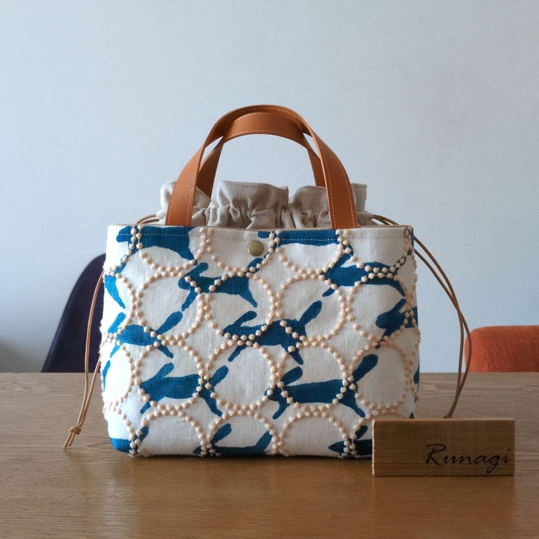 【1561】あおりポケットの巾着バッグ＊ミナペルホネン